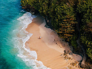 Cliffs with a white-sand beach near Uluwatu.