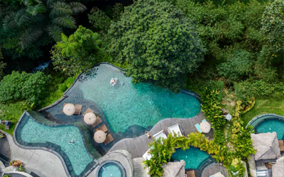 A hottub and many infinity pools overlook the jungle valley this resort is located in.