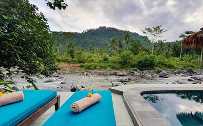 Relax on the shore of the Telaga Waja river.