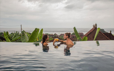 Enjoy a cocktail together on the edge of the pool overlooking the ocean.