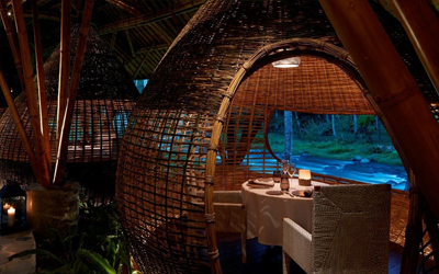 Reserve a private cocoon right next to the Ayung river for a very private romantic dining experience.