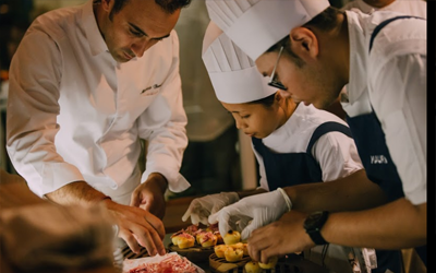 Maurizio and his collegues preparing dishes. You can opt for a private tasting experience while seated at the kitchen counter.