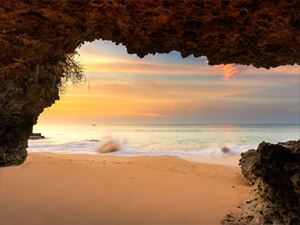 Sunset from Uluwatu Cave during low tide.